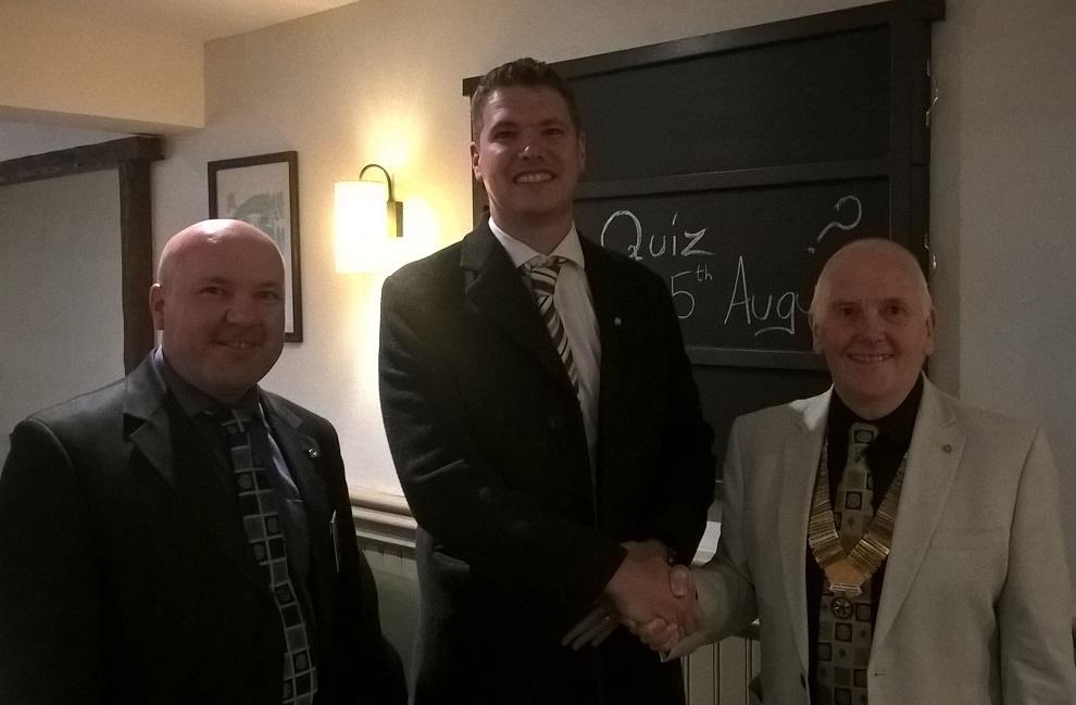 Andy Morgan (centre) is welcomed into Rotary by Past President Terry Clare (left) and Vice President John Lindon (right) on 14th August 2018