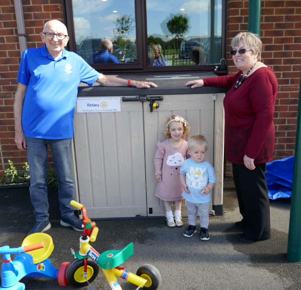 Rayleigh Mill Rotary Community and Vocational Committee Chairman, Bill Farmer and Christine Howard of the Grange Parent and Toddler Group with two of the group’s members 