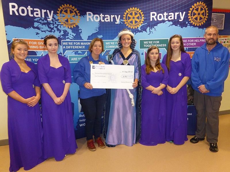 Herring Queen presented with a cheque by President Marina