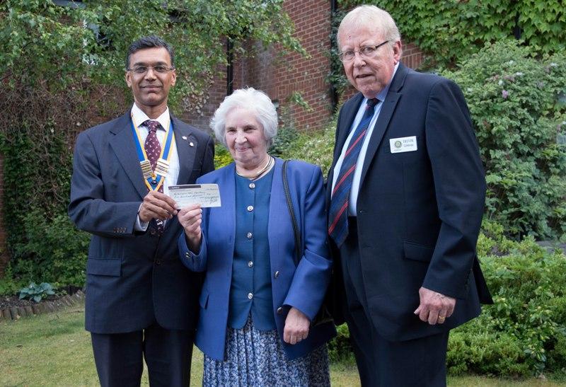 Mary Hansford (Parkinsons UK (Newbury Support Branch) tonight receiving a cheque for Â£500 from President Hemant with Rotarian Trevor Gibbons