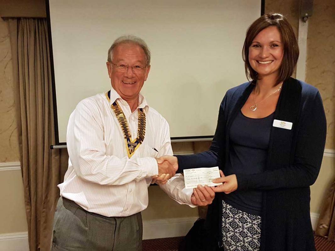 President Chris presents a cheque to Holly Parkin