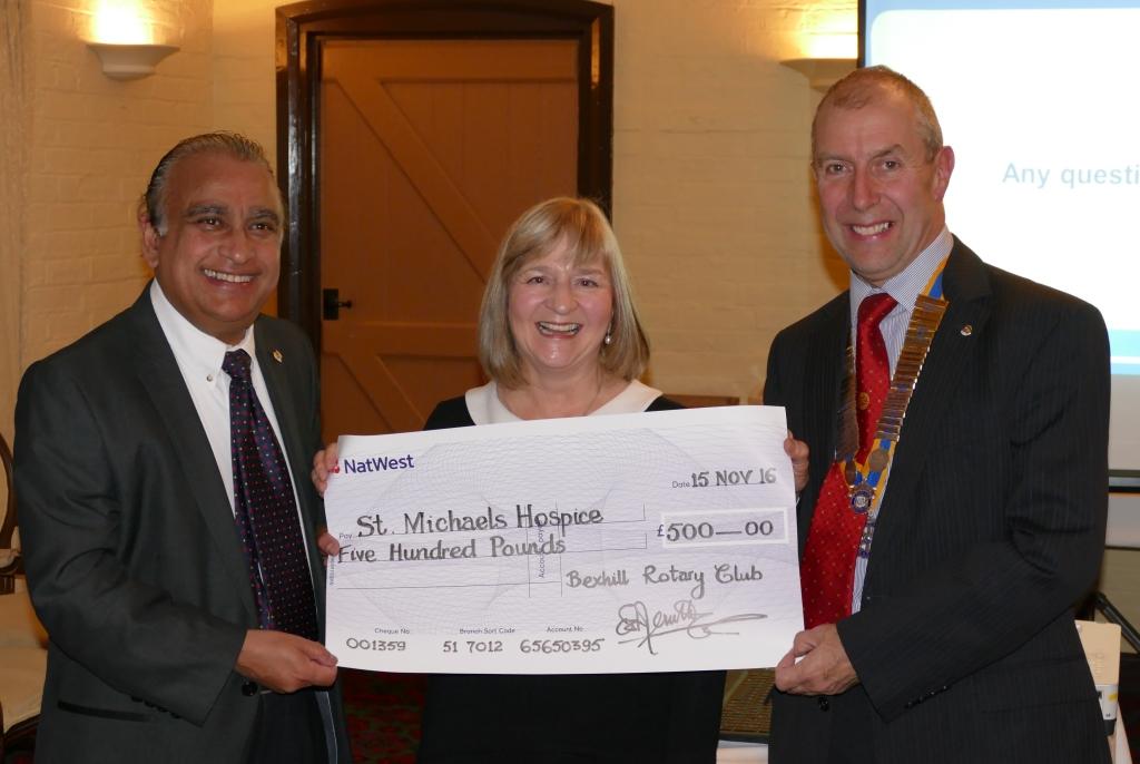 Jane Cave receives a Cheque from Geoff and Raouf. 