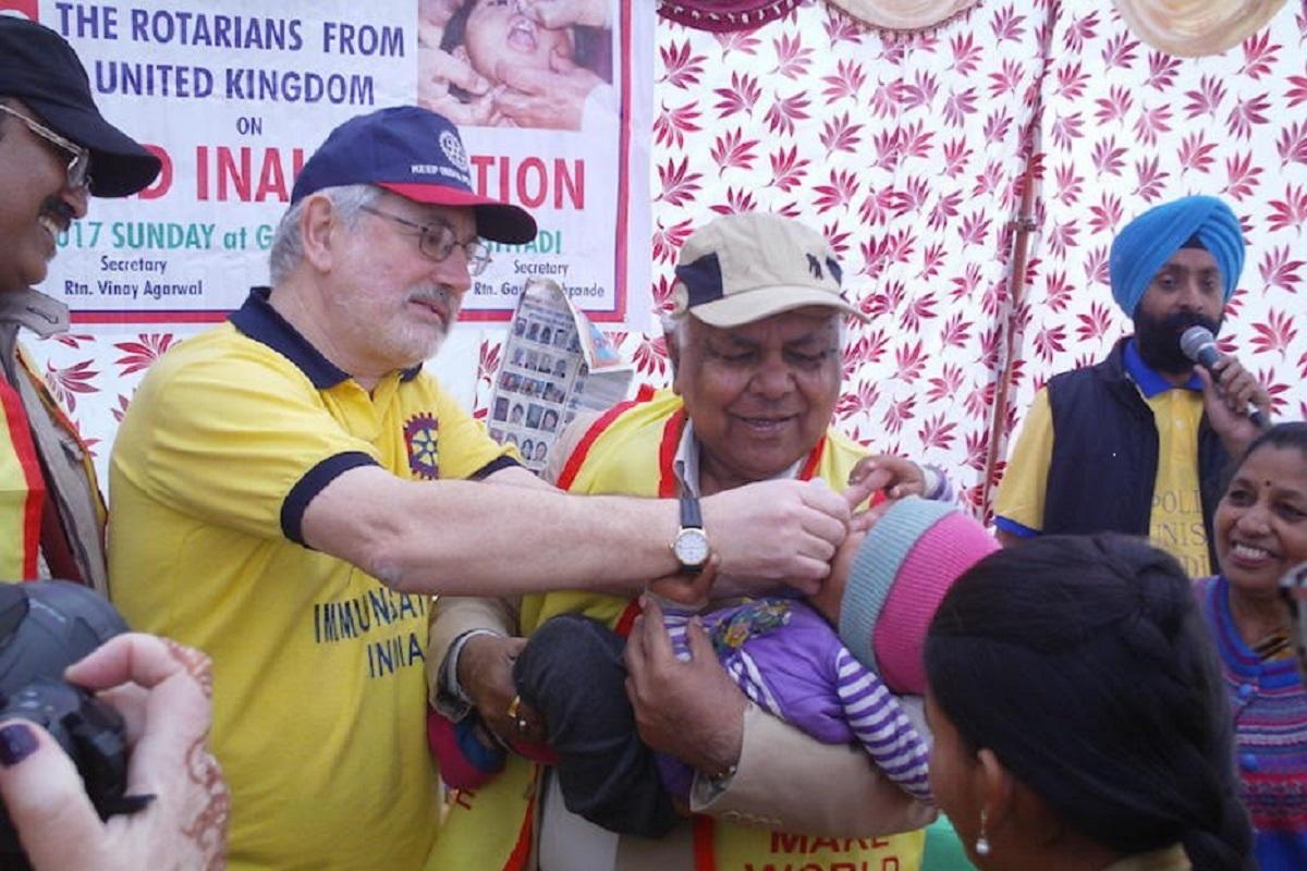 Rotarian Paul Harvey administering the ceremonial first vaccination of the National Immunisation Day in Bhiwadi.
