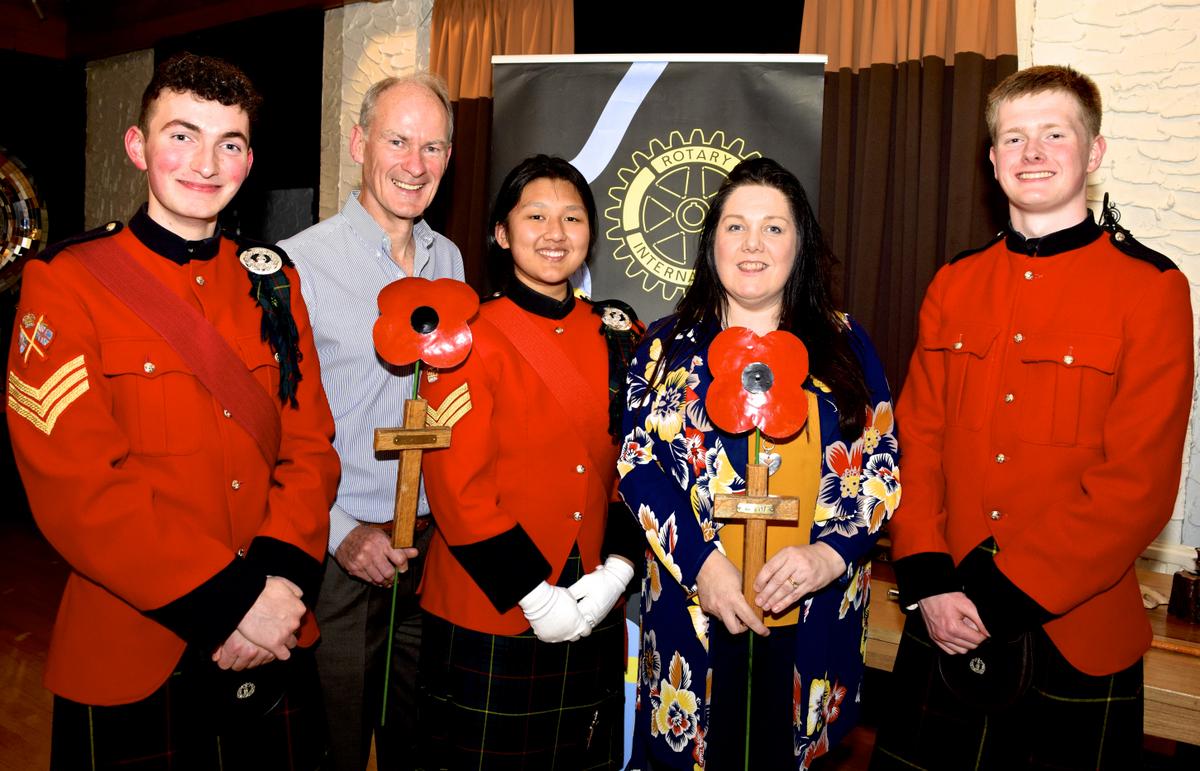 Rotarian Jill Adams (second right) with (l to r) Christian McBrearty, President-Elect Andrew Hilley, Anjipa Malla and Steven Rae.  The crosses being held are made from wood reclaimed from dining-room furniture 