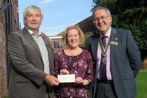 Community Chairman Mike Griffiths and President Dave Davies present Jill Livingstone with a cheque for £300