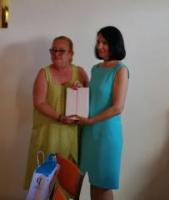 Ann presents iPad for Russian orphanage