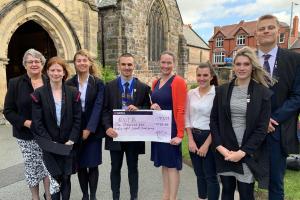 Rotary Interact pupils hand over the cheque for £1,098.09 to RNIB representatives.
From left to right: Mrs Sue Leonard, Anna Holbrook, Phoebe Munford, Andrei-Daniel Bahan, Amy and Sarah from the RNIB, Beth Williams and Ivan Majić.

