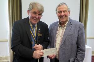 President Mark presents Graham with a cheque for Nightingale House Hospice