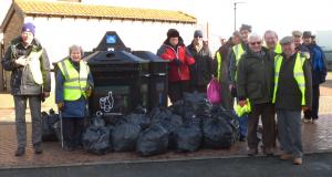 Litter pickers and 35  full plastic bags of rubbish.