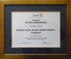 Certificate of 80 years membership presented by DG Roger Summers on behalf of Rotary International