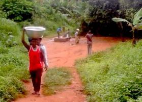 Carrying water from their existing inadequate borehole