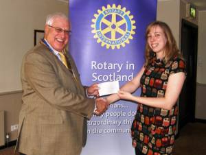 Sara Thomson from Chest Heart and Stroke (Scotland)receives a cheque for £1,500 from Club President John Liston