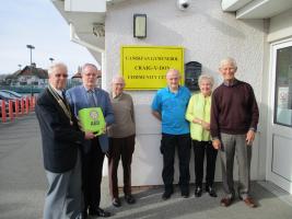 Llandudno Rotary present a defibrillator to Craig-y-Don Community Centre