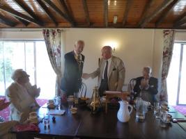 The induction of Roger by Past President Owen Pinney