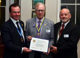 John Barrow receives his Paul Harris Fellowship award from District Governor Elect Robert Morphet