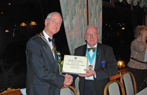 District Governor Richard Maunder presents Swanage & Purbeck Rotary President with a certificate to celebrate the 50th anniversary of the granting of their charter