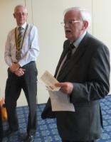 David Rogers talks to Oadby Rotary before presenting club president Philip Burrell with a cheque