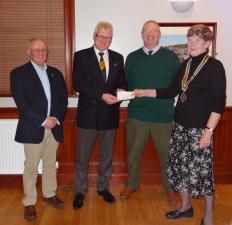 President Mairhi presents cheque for Â£3800 to Hawick Flood Protection Group members Stuart Marshall and Andy Lewis