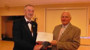 Photo shows Glyn receiving his certificate from Senlac Rotary President Roger Young.