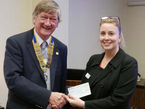 Claire Cosgrove collects a cheque for Â£2,870 for Hope for Tomorrow.