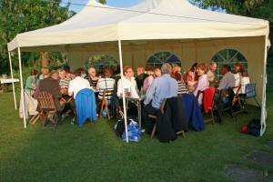 Members partners and guests enjoying one of the few sunny evenings in June 2012 in John and Molly's well tended garden.