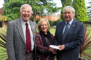 Peter Hill makes sure Mike Griffiths hands over the Carers 4 All cheque to Jill Livingstone