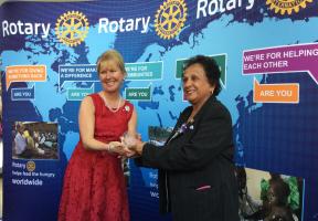 Rn Suraiya Kassamally receiving her Major Rotary Donor award and pin from RI Vice President Jennifer Jones 