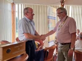2023 Handover - Outgoing President Andy Ireland handing over chain of office to Ken MacKenzie 