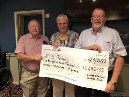 Bob Bragger from the Cambridge & District MS Society Group receives the £6495.35 donation from SVP Stuart, Steve Thompson (Blueshed)