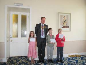 President John Isgrove with prizewinners, from left Emily Thomson (3rd), Robert Rawson (1st) and Finlay Murphy (4th)