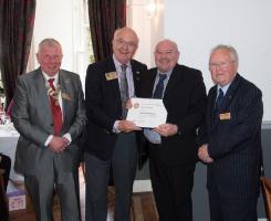 Kenny Wilson receives the Paul Harris Award from RIBI President, Peter Davey