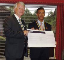 David Ball, Chair of NDCCT receives cheque for £5000 from incoming Club President, Hemant Amin