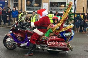 Santa Claus rides into town!