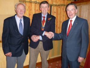 Rotarians Brian Morgan (left) and Robin Williams are welcomed to Denbigh by President Elfed.