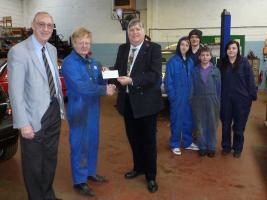 Ian Birrell presents the cheque to Project Manager John Bell