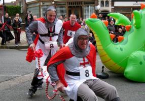 Wheelbarrow racers dressed for the occasion