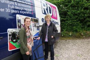 Lucy Palmer Account Executive at RDW Exhibitions present the carry bag to Hazel Yates of Oswestry Rotary Club