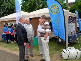 Club President Colin Green, (second from right), Club Secretary John Bush, (second from left), and Letchworth Howard member Mike Coleman (far right) chatting to a visitor to the club stand. 