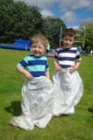 Two budding athletes competing in the Sack Race