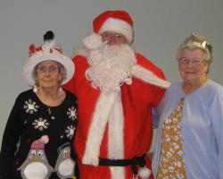 Santa, with two of our guests