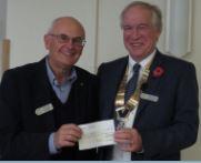 John receives another cheque to help with the establishment of a "Man's Shed" in Royal Wootton Bassett and District. 