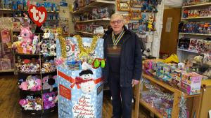 Club President Steve Knight with the donated toys