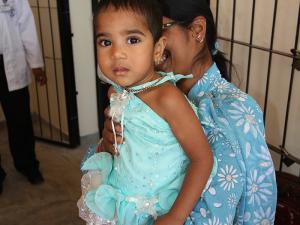 A young Sri Lankan girl arrives at the centre to receive a new limb