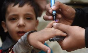  A Pakistani health worker marks a child"™s finger after administering polio drops during an immunisation campaign in Karachi. Photograph: Asif Hassan/AFP/Getty Images