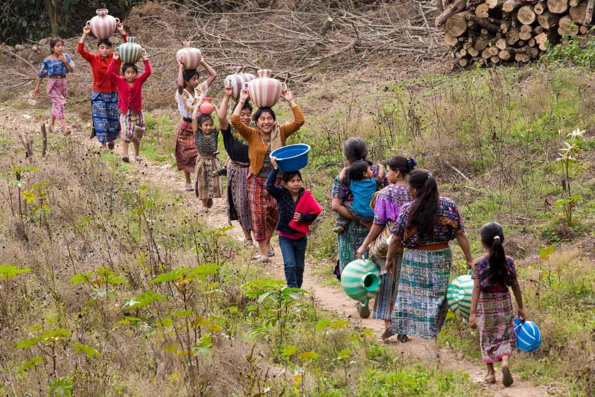 Women make their way to collect water for their families.  Rotary actively promotes  projects to provide clean water in poor areas abroad