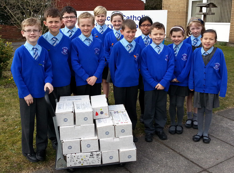 Pupils-of-St-Patricks-Primary-School-and some-of-their-filled shoeboxes.