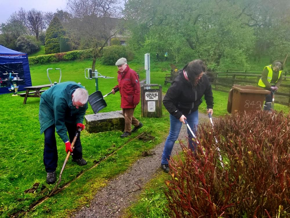 Rotarians and friends working hard at Lumb Millennium Green