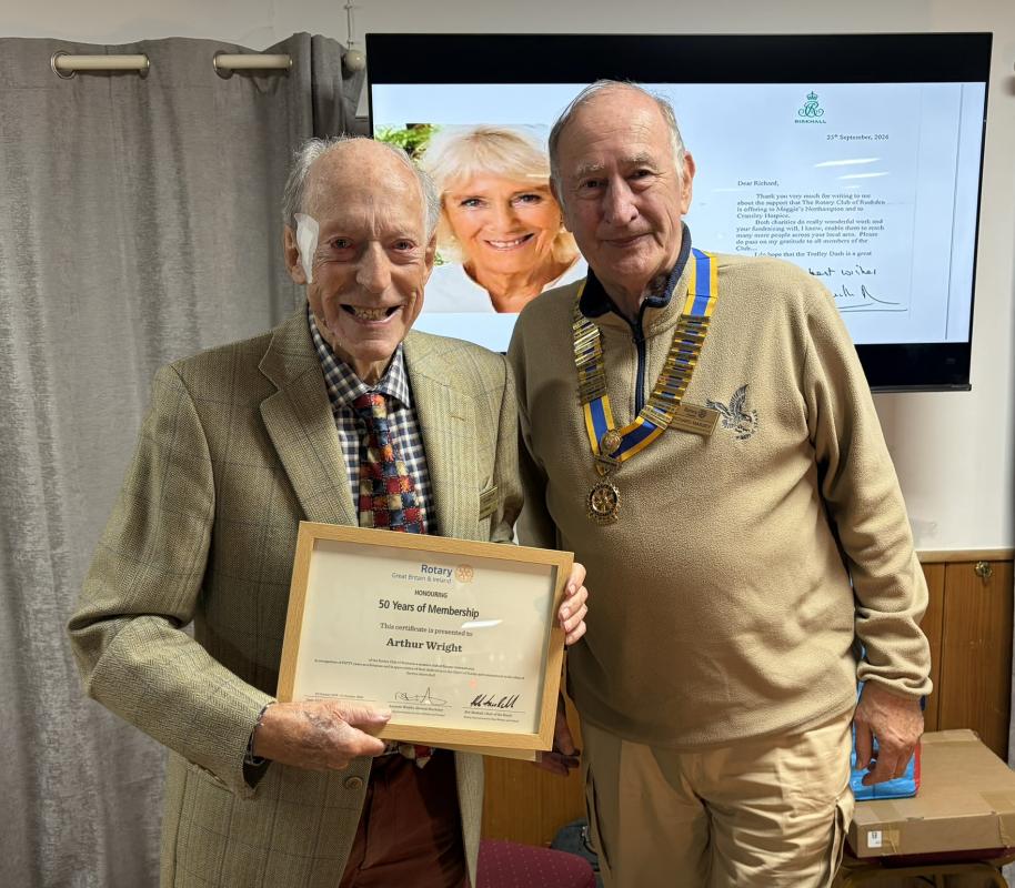 Arthur being presented with a certificate from Rotary GB & I acknowledging his achievement