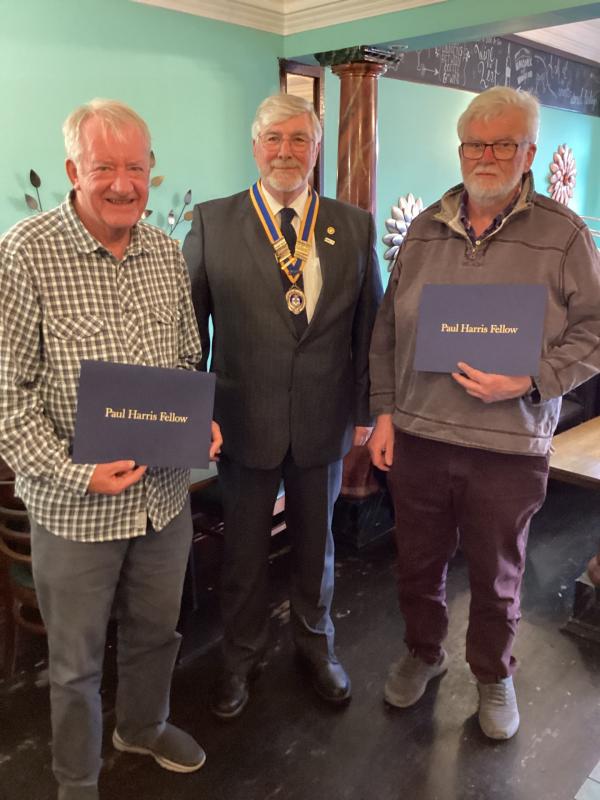 President Garaint Short awarded Paul Harris Fellowships to Past Presidents Alan Dean, left, and David Chapman, right, for service to Club and the local community over many years.
