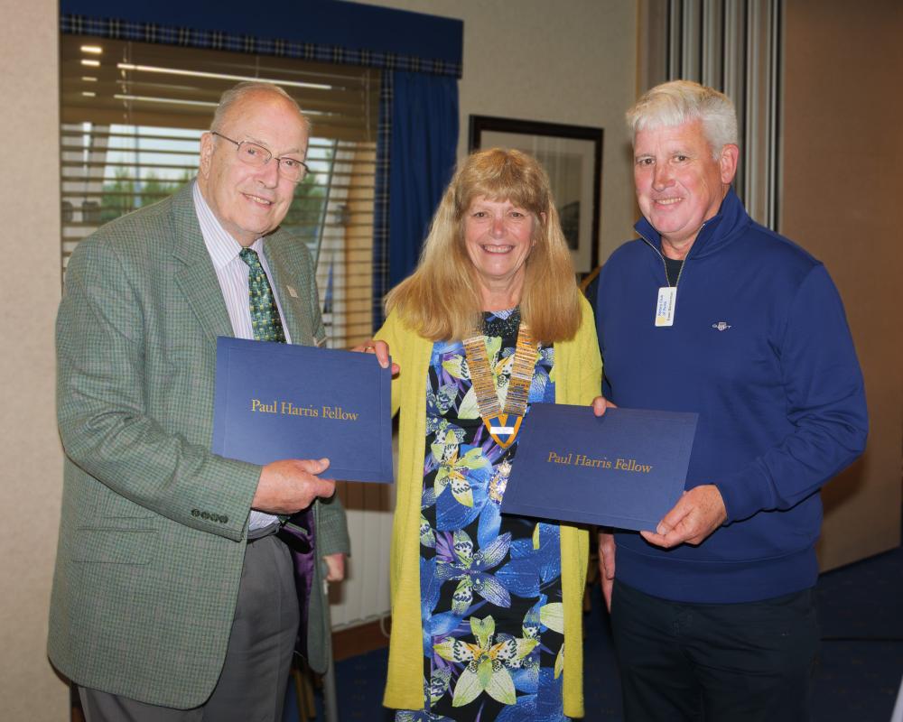 President Anna presents Paul Harris Fellowship awards to Ian and Ewan